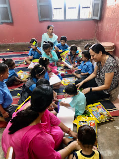 Anganwadi children gifted coloring sets